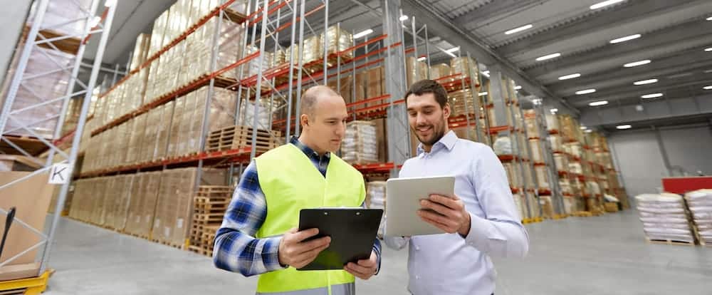 2 men in warehouse